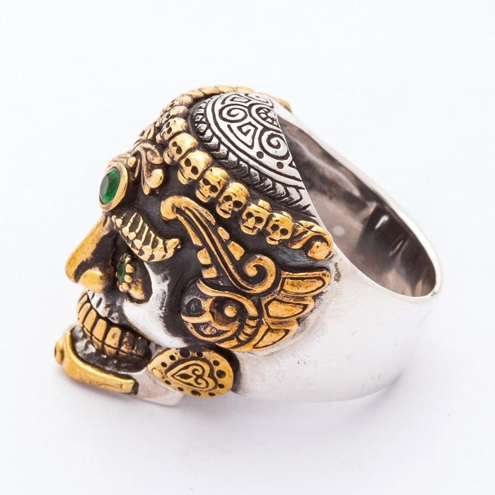 Close-up left side view highlighting the ornate gold-tone cheek details, heart-shaped jaw hinge, and carved silver cranium.
