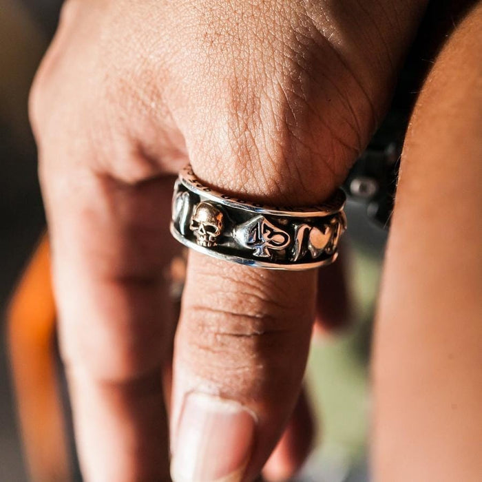 A handcrafted gold skull biker spinner ring in solid 925 sterling silver.