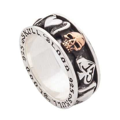 An angled view of the biker symbols spinner ring, showing the 13 spade and gold skull.