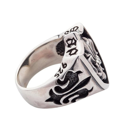 Side detail of the handcrafted gothic shield ring, showing the 925 stamp and gothic band carvings.