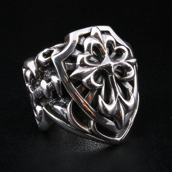 Left angle view of handcrafted shield cross ring displaying oxidized gothic cross design
