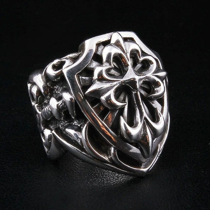 Left angle view of handcrafted shield cross ring displaying oxidized gothic cross design