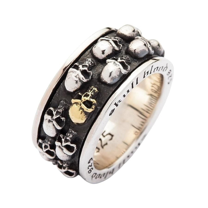 The two-tone skull spinner ring isolated on a clean white background to showcase its unique design.