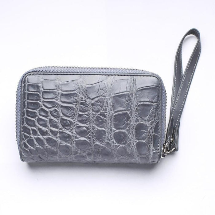 Back panel of gray crocodile wallet featuring smooth belly leather