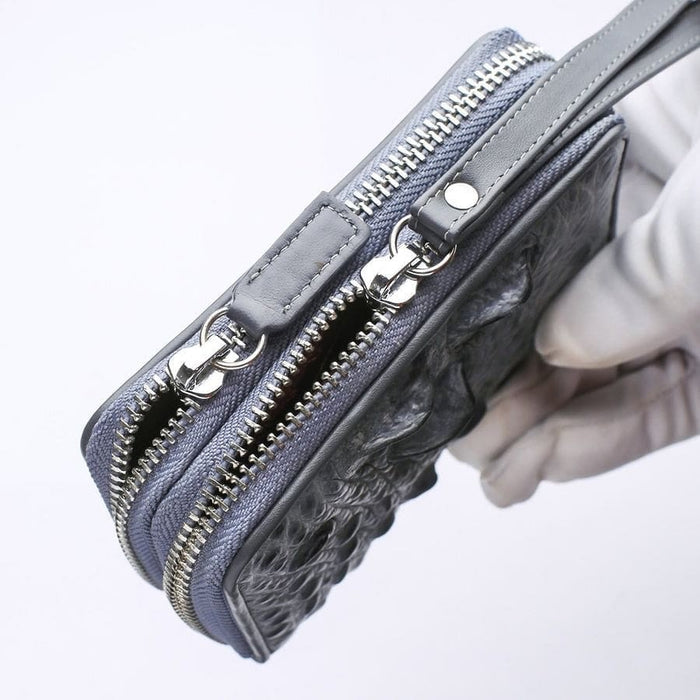 Gray crocodile wristlet wallet showing silver-tone zipper hardware