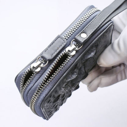 Gray crocodile wristlet wallet showing silver-tone zipper hardware