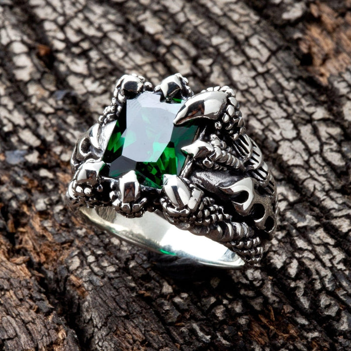 An alternative angle of the gothic monster claw ring with its large green stone.