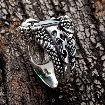Side view of the green dragon claw ring showing pierced flame cutwork on the scaled sterling silver band.