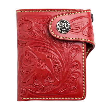 A compact red leather biker wallet with a floral pattern, shown on a clean white background to highlight its color.