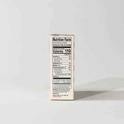 Side view of a single pack of junket very vanilla ice cream on a grey background