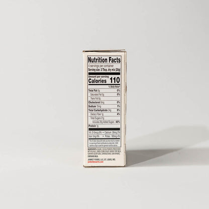 Side view of a single pack of junket dutch chocolate ice cream on a grey background