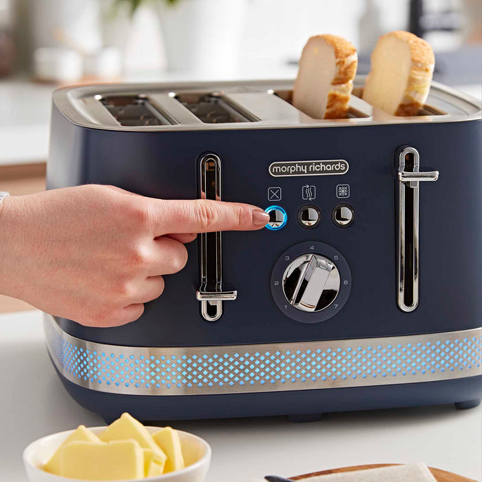 someone pressing the cancel button on a navy 4 slice toaster