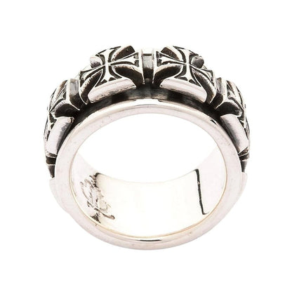 Close-up detail of the handcrafted oxidized finish on the biker spinner ring.