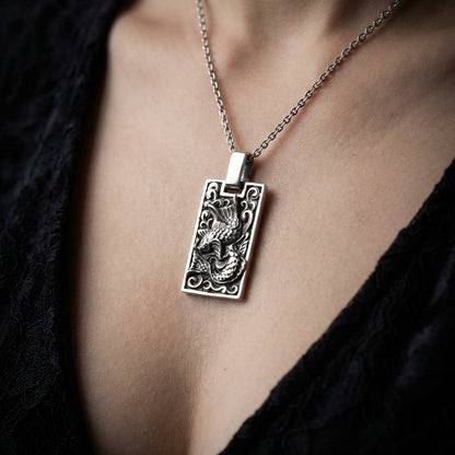 Japanese Koi fish sterling silver pendant worn on silver chain necklace showing scale and styling