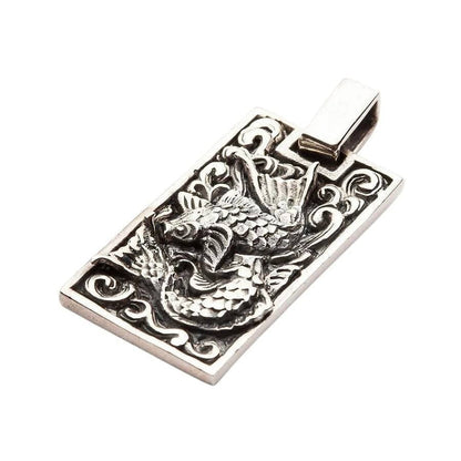 Angled view of handcrafted Koi fish sterling silver pendant highlighting 3D scale texture and fins