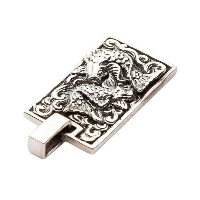 Reverse angle view of Japanese Koi pendant displaying polished silver contrast against dark oxidized background