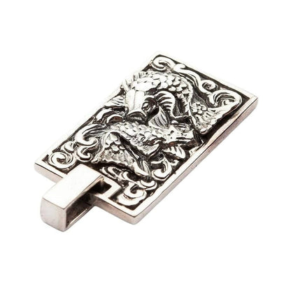 Reverse angle view of Japanese Koi pendant displaying polished silver contrast against dark oxidized background