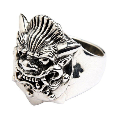 Three-quarter view of heavy sterling silver Hannya ring showing ridged forehead texture, pointed horns, and cross cutout on band shank
