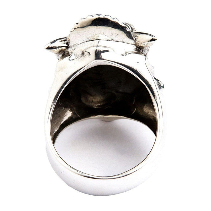 Back view of Hannya mask sterling silver ring showing smooth polished band, hollow sculpted interior, and horn tips from behind