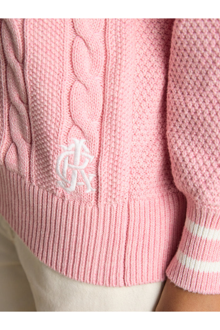 Close-up of textured knit and ribbed hem on Joules W25282 Dibly Cable Knit Jumper – Pink by Joules. Shop Joules at Dotique.