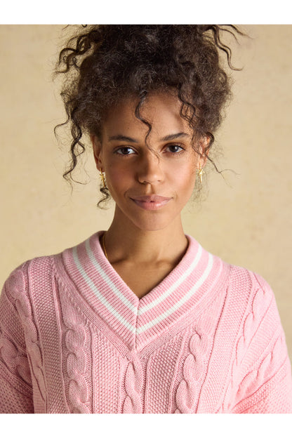 Close-up of model wearing Joules W25282 Dibly Cable Knit Jumper – Pink with V-neck and striped collar by Joules. Shop Joules at Dotique.