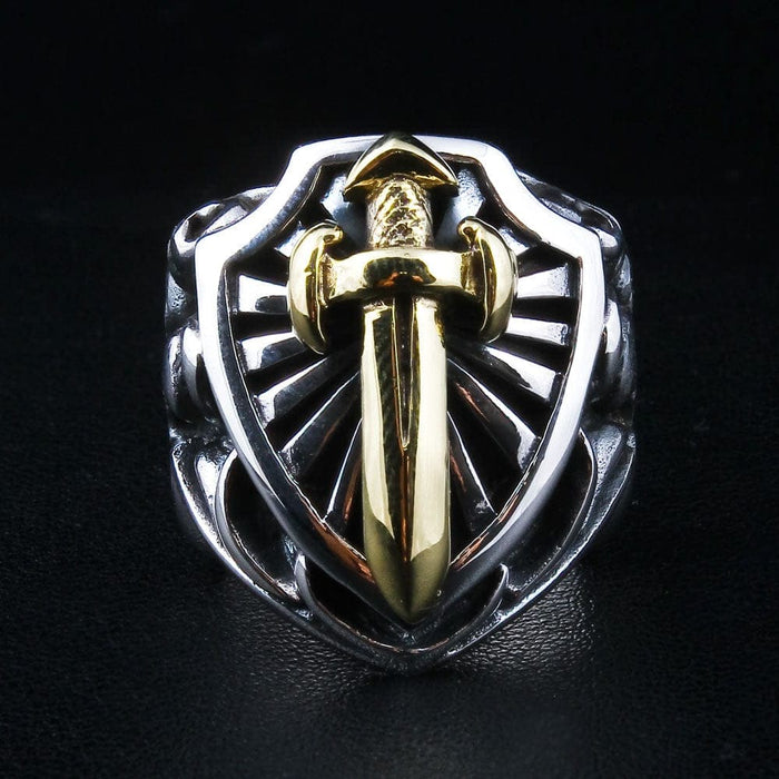 Front view of the sterling silver knight shield ring, featuring a gold-plated sword and radiating background.