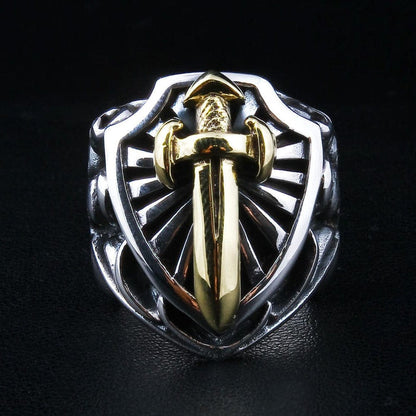 Front view of the sterling silver knight shield ring, featuring a gold-plated sword and radiating background.