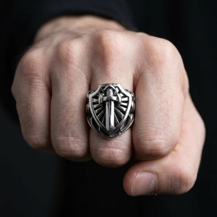 Man wearing heavy sterling silver knight sword ring on fist
