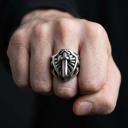 Man wearing heavy sterling silver knight sword ring on fist