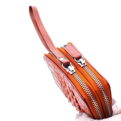Side profile of crocodile tail skin wallet highlighting raised scale details