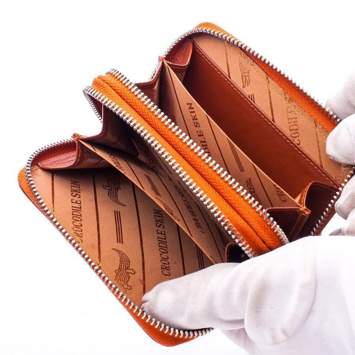 Open view of crocodile wallet showing interior compartments and lining