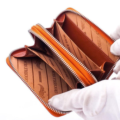 Open view of crocodile wallet showing interior compartments and lining