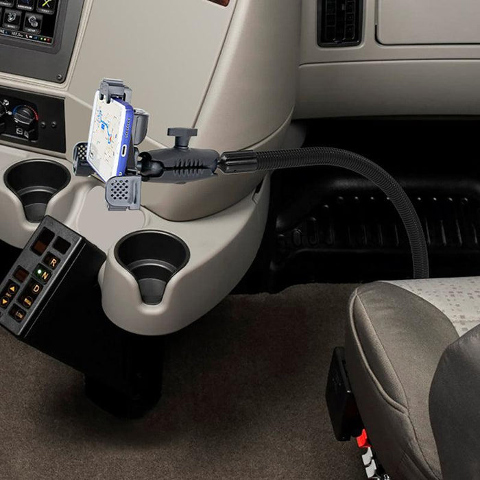 A smartphone secured on the LockVise™ Locking Seat Rail or Floor Phone Mount by the center console, displaying navigation near cup holders and control buttons.