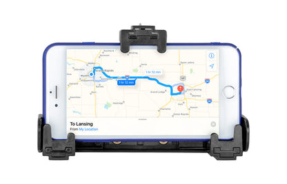 A smartphone in a black LockVise™ Universal Locking Phone Holder with Key Lock displays a navigation map showing a blue route from Grand Rapids to Lansing, with an estimated travel time of 1 hour and 12 minutes.