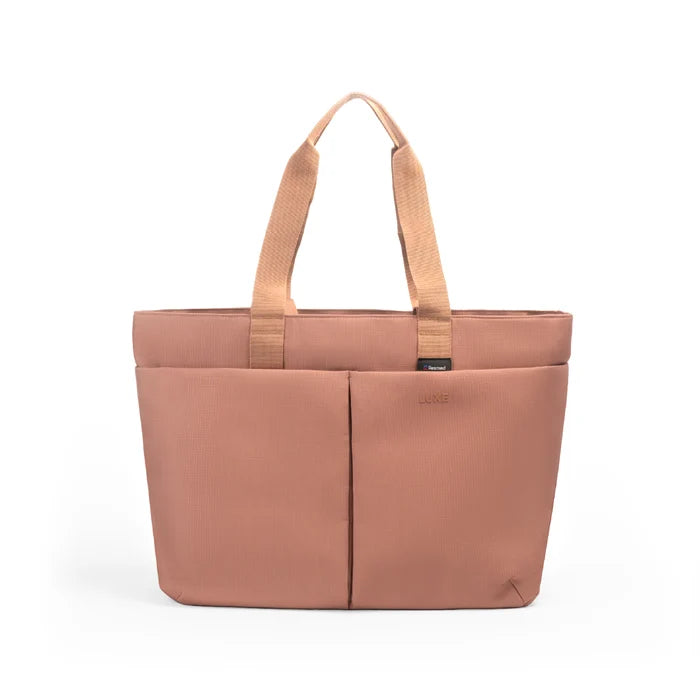 Luxe Tote bag A dusty rose tote bag with dual top handles and a front vertical seam, shown on a clean white background.
