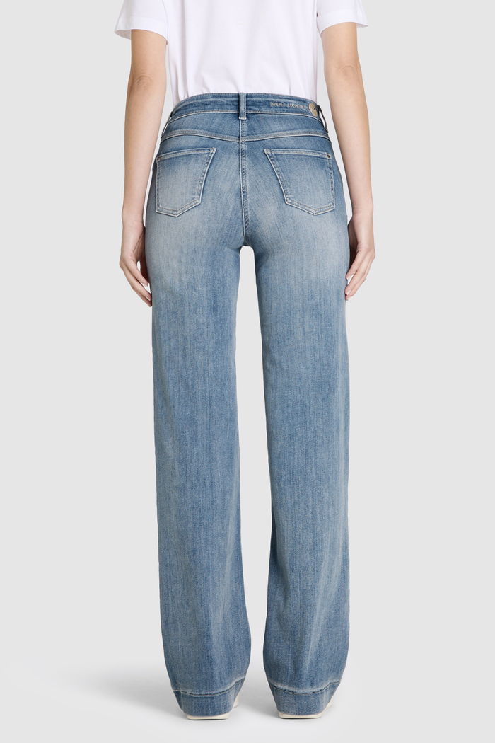 Model wearing MAC Dream Wide Authentic Sky Blue Wash wide leg stretch jeans in a light blue denim wash. Shop MAC Jeans at Dotique.