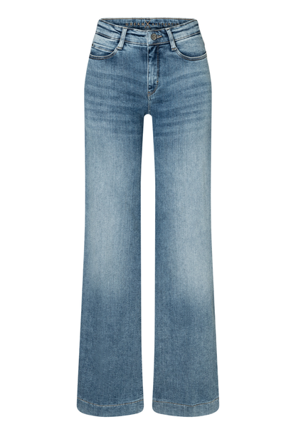 Model wearing MAC Dream Wide Authentic Sky Blue Wash wide leg stretch jeans in a light blue denim wash. Shop MAC Jeans at Dotique.