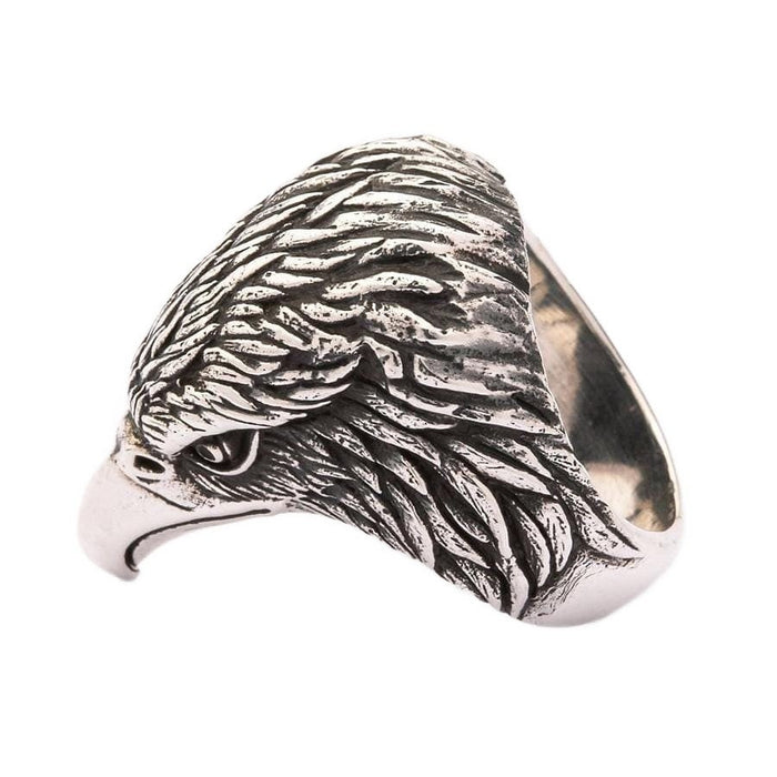 Angled side view of men's eagle head statement ring showing curved beak and layered feather detail