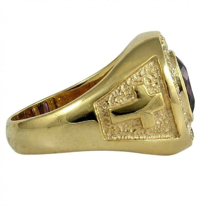 Handcrafted ecclesiastical ring showing textured gold band with raised cross design