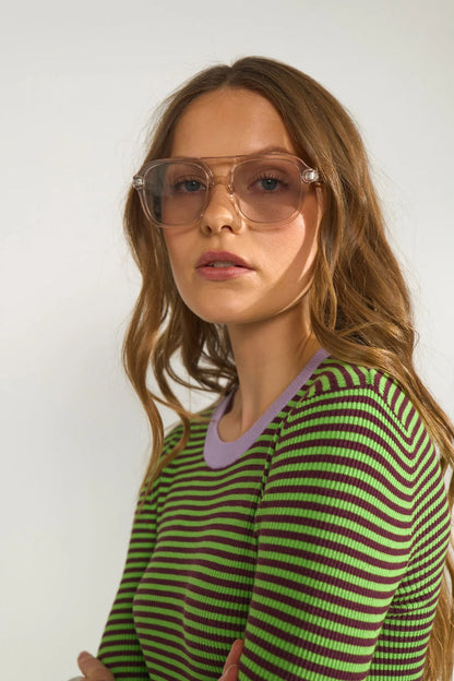 Close-up of a model wearing Numph 706923 NUFILINA Pullover – Fig in green and dark purple stripes with a lavender neckline by Numph. Shop Numph at Dotique.
