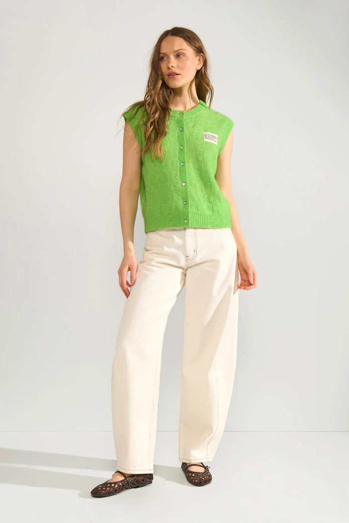 Model wearing Numph 706928 NURIETTE CHECK VEST – Jasmine Green sleeveless button-up vest by Numph. Shop Numph at Dotique.