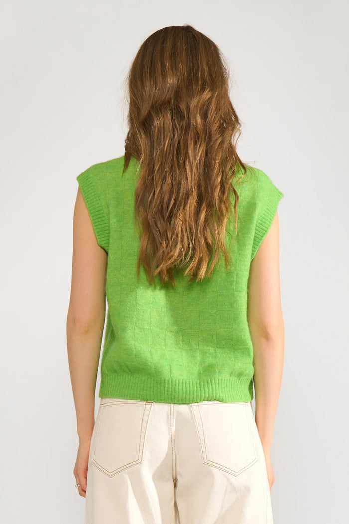 Back view of a model wearing Numph 706928 NURIETTE CHECK VEST – Jasmine Green sleeveless check-patterned vest by Numph. Shop Numph at Dotique.