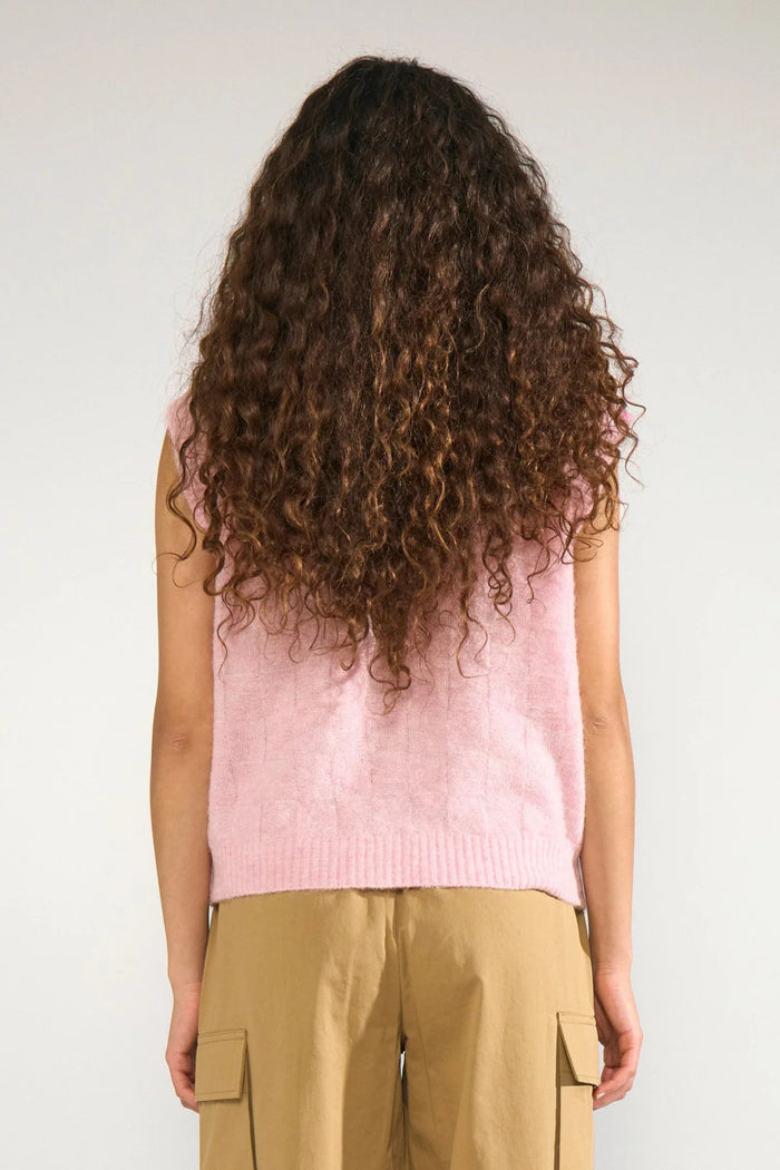 Back view of a model wearing Numph 706928 NURIETTE CHECK VEST – Pink Lady sleeveless knitted vest by Numph. Shop Numph at Dotique.