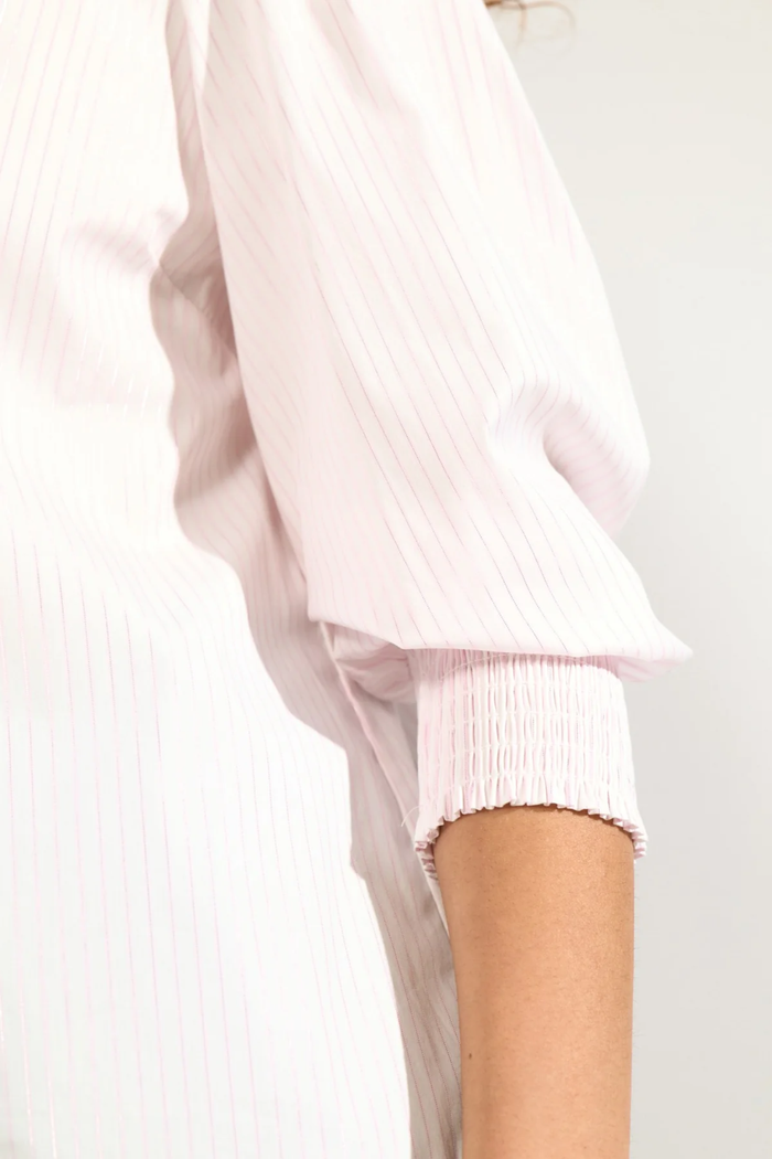 Close-up of sleeve detail on Numph 707070 Nulili Blouse Pink Lady featuring fine pink stripes and smocked cuff by Numph. Shop Numph at Dotique.
