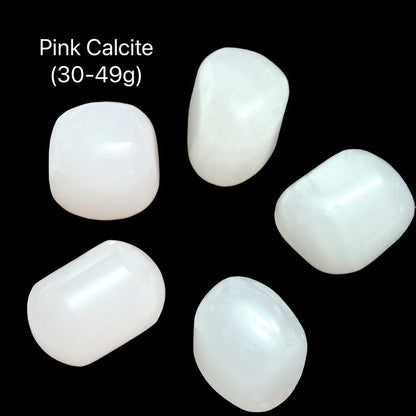 Pink Calcite stones on a black background, the weight is (30-49g), front view.