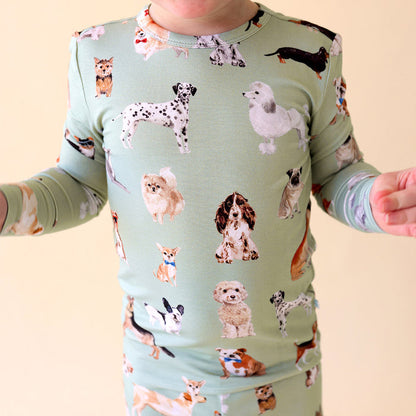 close-up of child wearing green dog patterned pajama set