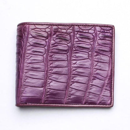 Front view of a men's bifold wallet crafted from genuine crocodile leather in a deep plum purple tone.