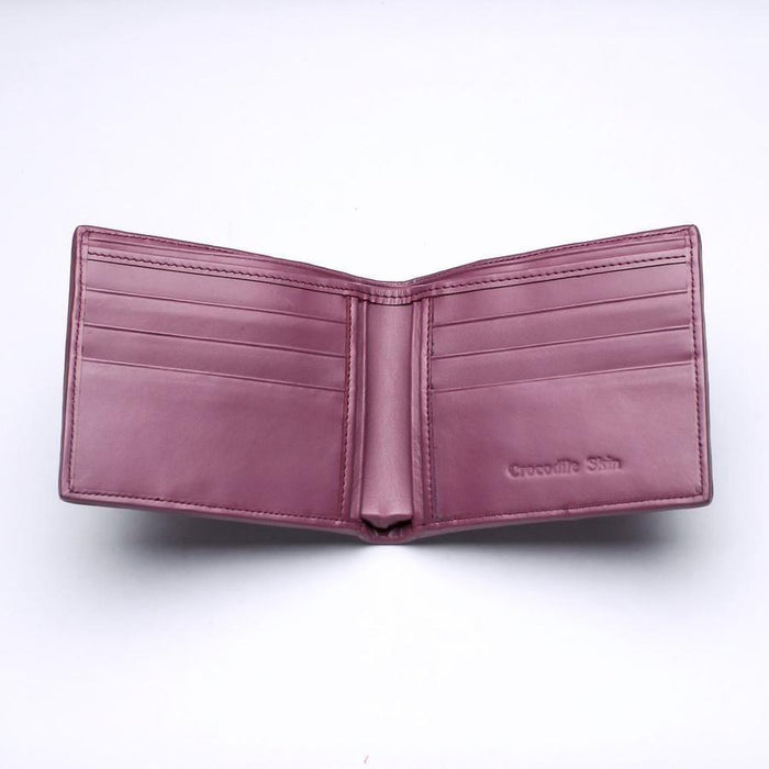 Smooth plum leather interior displaying symmetrical card slots and an embossed Crocodile Skin stamp on the right panel.