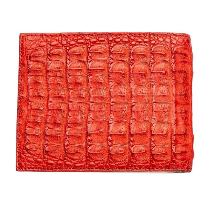 Large glossy crocodile scales cover the red wallet, stitching closing the top, bottom and left edges.