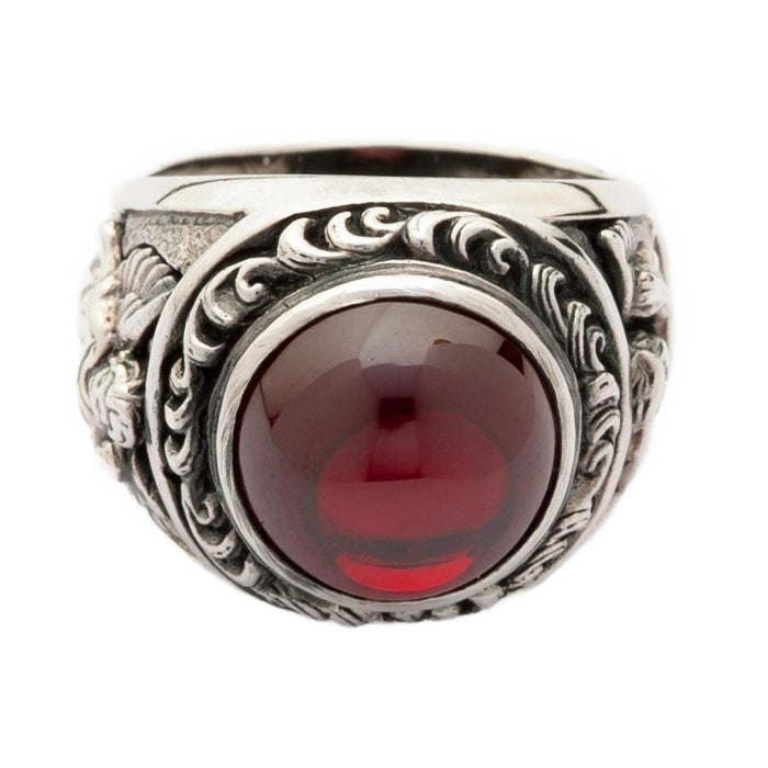 A front view of the sterling silver red stone cupid love ring, showing the large cabochon gemstone.
